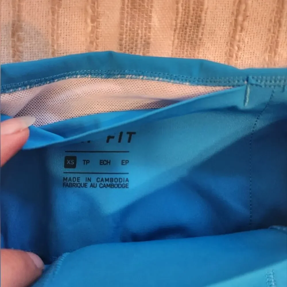 NIKE Dri fit Bungee Detail workout leggings In Aqua Blue XS